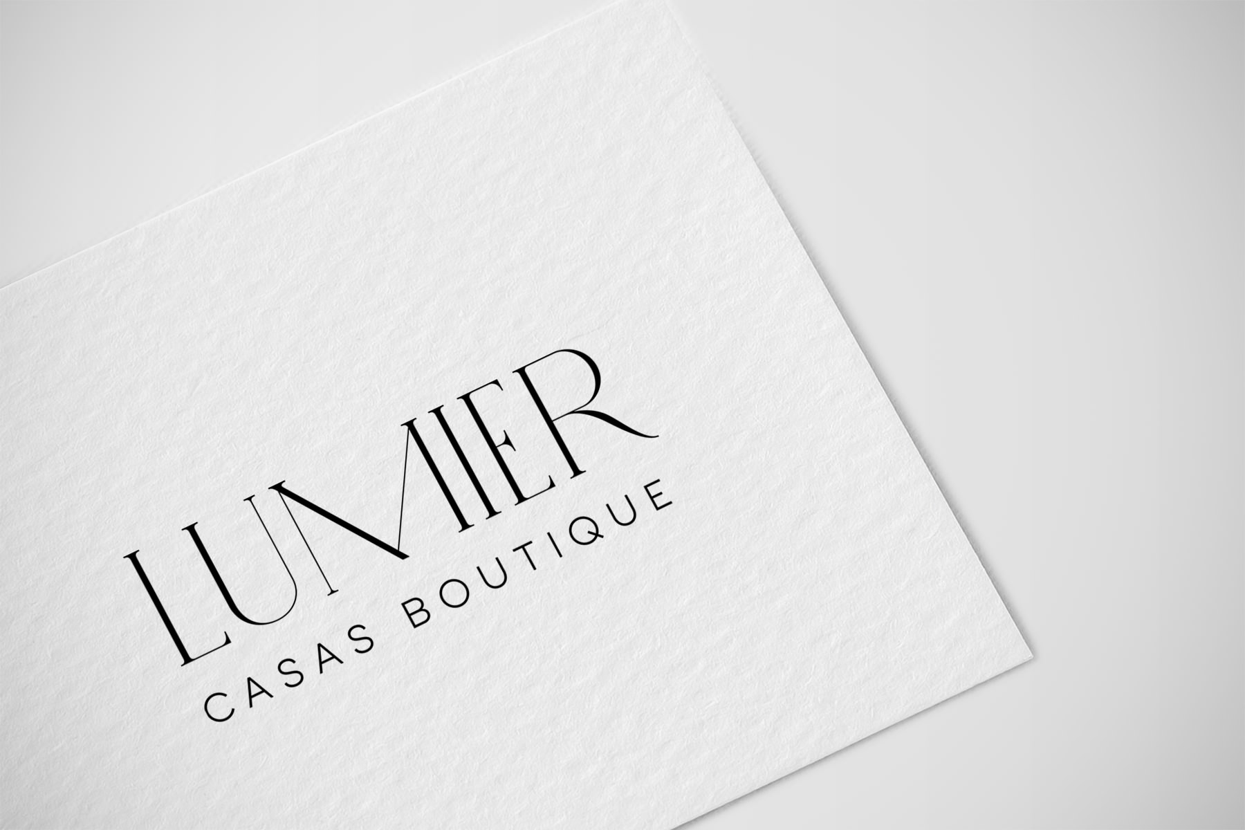 Diseño gráfico y maquetación Madrid, logotipo Lumier Casas Boutique